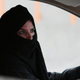 Aziza Yousef drives a car on a highway in Riyadh, Saudi Arabia, Saturday March 29, 2014, as part of a campaign to defy Saudi Arabia’s ban on women driving. Photo via AP Images.